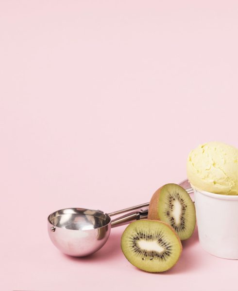 ice-cream-balls-cup-near-kiwi-with-scoop-flower